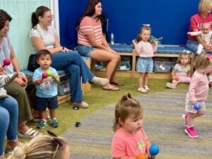 photo of children and caregivers at "Toddler Storytime."