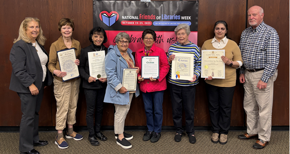 photo of Library Board Chair Colleen Foley, Friends Director Cathy Walsh, volunteers Jann Tobias and Betty Tagliamonti, Friends Directors Rena Kuhl and Patricia Heaney, volunteer Saima Ajmal and Village Trustee Bruce Torino.